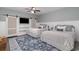 Comfortable bedroom with two beds, stylish decor, and a modern ceiling fan at 53 Hope Ln., Pawleys Island, SC 29585