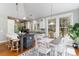 Stylish kitchen with modern appliances, an island with bar seating, and an adjacent dining area at 53 Hope Ln., Pawleys Island, SC 29585