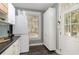 Convenient laundry room features a stackable washer and dryer and abundant storage at 53 Hope Ln., Pawleys Island, SC 29585