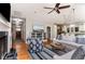 Spacious living room with hardwood floors, a fireplace, and an open floor plan to the kitchen at 53 Hope Ln., Pawleys Island, SC 29585