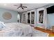 Relaxing main bedroom with private balcony access and natural light at 53 Hope Ln., Pawleys Island, SC 29585
