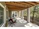 Covered patio with concrete floor, decorative columns, and backyard view at 53 Hope Ln., Pawleys Island, SC 29585