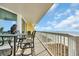 Spacious balcony featuring ocean views and charming outdoor seating area at 5404 N Ocean Blvd. N # 6-E, North Myrtle Beach, SC 29582