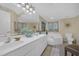 Bright bathroom featuring a double vanity and a large soaking tub at 5404 N Ocean Blvd. N # 6-E, North Myrtle Beach, SC 29582