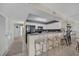 Functional kitchen with breakfast bar, white cabinetry, and ample counter space at 5404 N Ocean Blvd. N # 6-E, North Myrtle Beach, SC 29582