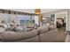Inviting living room with large sectional sofa, ocean view, and stylish decor at 5404 N Ocean Blvd. N # 6-E, North Myrtle Beach, SC 29582