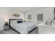 Comfortable bedroom featuring a bed, side tables, a window, and modern decor at 572 Strawberry Field Way, Galivants Ferry, SC 29544