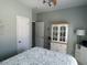 Cozy bedroom features soft green walls, white trim, and a ceiling fan with a light fixture at 59 Willowbend Dr., Murrells Inlet, SC 29576