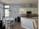 Charming kitchen and dining area with white cabinetry and modern appliances at 59 Willowbend Dr., Murrells Inlet, SC 29576