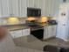 Updated kitchen boasts stainless steel appliances, granite countertops, and ample cabinet space at 59 Willowbend Dr., Murrells Inlet, SC 29576
