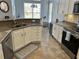 Bright eat-in kitchen features stainless appliances, granite counters, and lots of natural light at 59 Willowbend Dr., Murrells Inlet, SC 29576