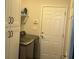 Well-lit laundry room includes modern washer/dryer, storage shelving and utility sink at 59 Willowbend Dr., Murrells Inlet, SC 29576