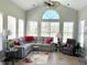 Spacious living room with large windows, vaulted ceiling, and a comfortable sectional sofa at 59 Willowbend Dr., Murrells Inlet, SC 29576