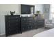 Bedroom boasts matching dresser and nightstand set with lots of storage space at 59 Willowbend Dr., Murrells Inlet, SC 29576