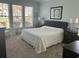 Inviting main bedroom features large windows, carpeted floors and ample sunlight at 59 Willowbend Dr., Murrells Inlet, SC 29576