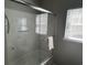 Shower with sliding glass door, built-in shelves, and hand towel at 59 Willowbend Dr., Murrells Inlet, SC 29576