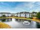 Aerial shot showcasing a community with water views of a pond and fountain at 6253 Catalina Dr. # 214, North Myrtle Beach, SC 29582