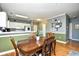 Open concept kitchen and dining room with hardwood floors and stylish decor at 6253 Catalina Dr. # 214, North Myrtle Beach, SC 29582