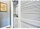 A convenient laundry closet with a stacked washer and dryer, maximizing space efficiency at 6253 Catalina Dr. # 214, North Myrtle Beach, SC 29582