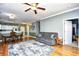 Comfortable living space with hardwood floors and cozy gray sofa and area rug at 6253 Catalina Dr. # 214, North Myrtle Beach, SC 29582