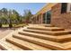 Multi-level wooden deck with railing, perfect for outdoor relaxation and enjoying the backyard views at 7638 Highway 905, Longs, SC 29568