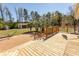 Wooden deck with palm trees overlooking spacious backyard and detached garage at 7638 Highway 905, Longs, SC 29568