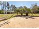 Brick patio, hammock, palm trees and detached garage in the backyard at 7638 Highway 905, Longs, SC 29568