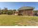 Spacious backyard with brick house, palm trees and shed at 7638 Highway 905, Longs, SC 29568