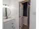 Bathroom with modern vanity, round mirror, and updated lighting at 7638 Highway 905, Longs, SC 29568