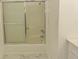 Bathroom featuring a bathtub and shower with sliding glass doors at 7638 Highway 905, Longs, SC 29568