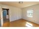 Bright bedroom with hardwood floors, a window for natural light, and a closet at 7638 Highway 905, Longs, SC 29568