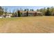 Brick ranch-style house with large front yard and mature trees at 7638 Highway 905, Longs, SC 29568