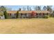 Charming one story home with brick facade, covered porch, and front yard at 7638 Highway 905, Longs, SC 29568