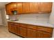 Kitchen featuring wood cabinets, marble countertops, and stainless steel sink at 7638 Highway 905, Longs, SC 29568