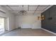 Inviting living room with hardwood floors, modern lighting, and access to stairs at 7638 Highway 905, Longs, SC 29568