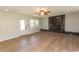 Bright living area with hardwood floors, fireplace, TV, and neutral paint at 7638 Highway 905, Longs, SC 29568