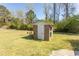 Brick outbuilding and garden shed in a sprawling, well-maintained yard at 7638 Highway 905, Longs, SC 29568