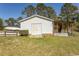 White outbuilding with boat parked nearby, offering ample storage space for recreational equipment at 7638 Highway 905, Longs, SC 29568