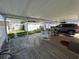 A full view of the back yard, including back porch seating and the covered parking at 806 Duncan Ave., Myrtle Beach, SC 29572