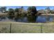 Overlooking a tranquil pond with a house in the background, creating a peaceful and private outdoor oasis at 806 Duncan Ave., Myrtle Beach, SC 29572