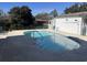 Backyard pool with a white fence, steps, and a nearby storage shed at 806 Duncan Ave., Myrtle Beach, SC 29572