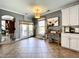 Bright breakfast nook features natural light, access to the deck, and decorative touches at 817 Falkirk St., Myrtle Beach, SC 29579