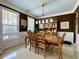 Formal dining room features chandelier, wainscoting, and hardwood table and chairs at 817 Falkirk St., Myrtle Beach, SC 29579