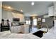 Open kitchen boasts white cabinets, stainless steel appliances, marble countertops and breakfast nook at 817 Falkirk St., Myrtle Beach, SC 29579