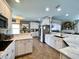 Bright kitchen features white cabinets, stainless steel appliances, and marble countertops at 817 Falkirk St., Myrtle Beach, SC 29579