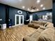 Open living room featuring a comfortable sectional, french doors, hardwood floors and ample lighting at 817 Falkirk St., Myrtle Beach, SC 29579