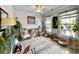 Cozy living room features lots of plants and natural lighting with stylish decor at 817 Falkirk St., Myrtle Beach, SC 29579