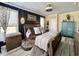 Comfortable bedroom offers lots of natural lighting, dark accent wall, and stylish decor at 817 Falkirk St., Myrtle Beach, SC 29579
