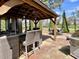Outdoor living space featuring a stylish gazebo and dining area with grill at 817 Falkirk St., Myrtle Beach, SC 29579
