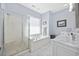 This bathroom has a soaking tub with a glass block window and separate glass shower at 820 Morrall Dr., North Myrtle Beach, SC 29582
